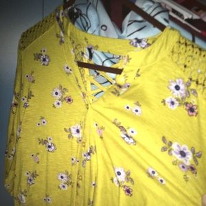 Yellow flower printed shirt.